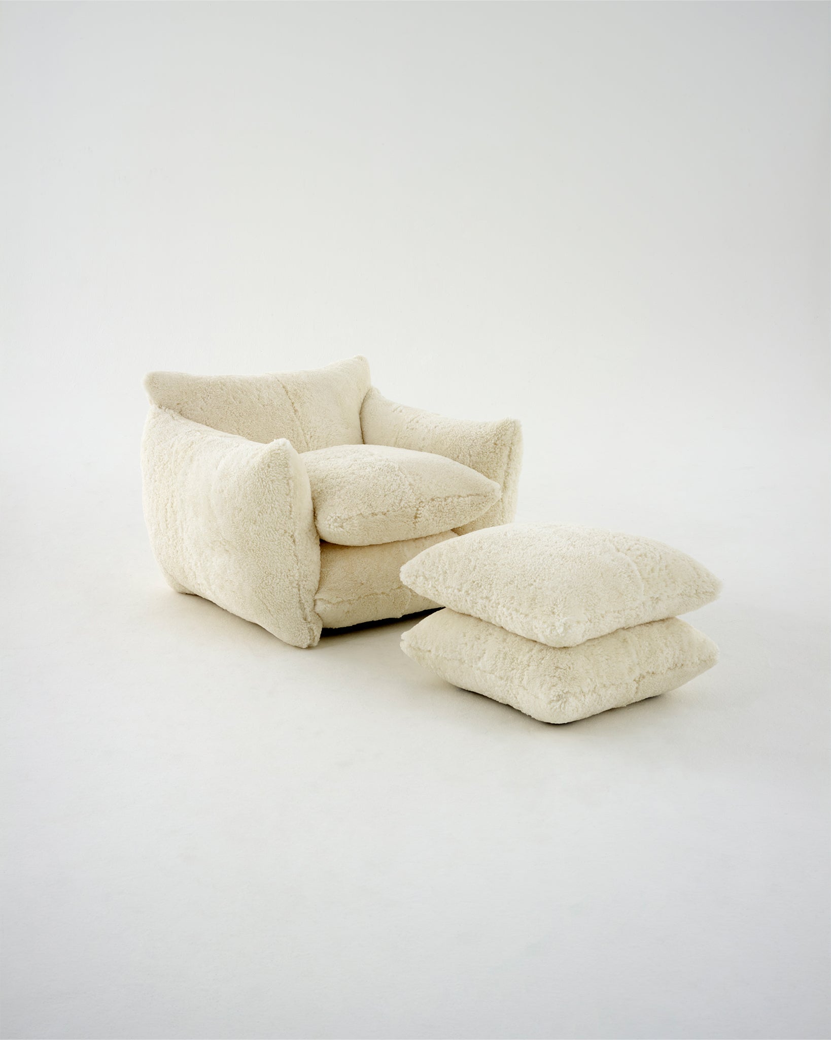 The Studio Chair and Studio Footstool in 'Cloud' Shearling