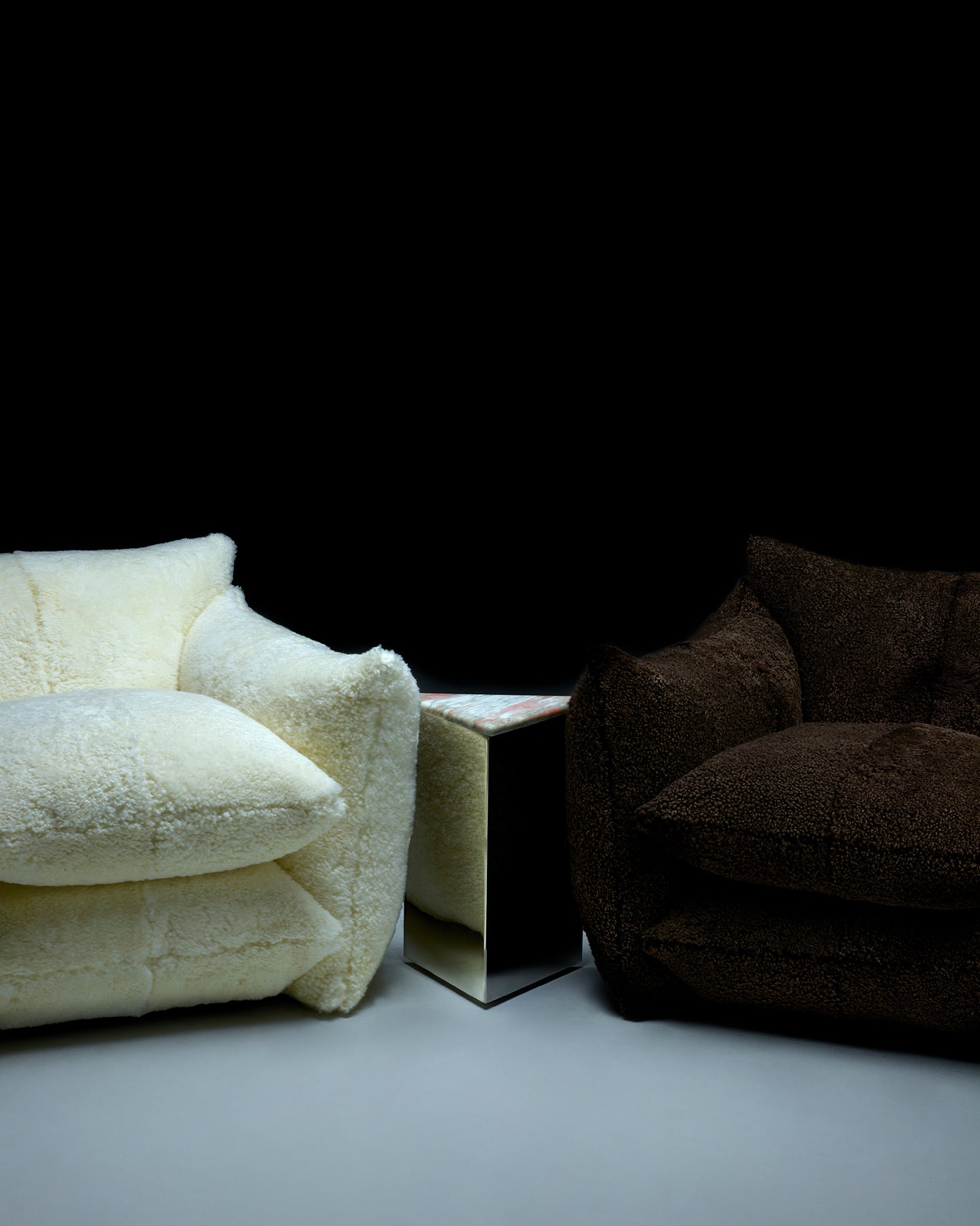 Small Prism Table with Norweigan Rose Marble top between Shearling Studio Chairs in Cloud and Bear