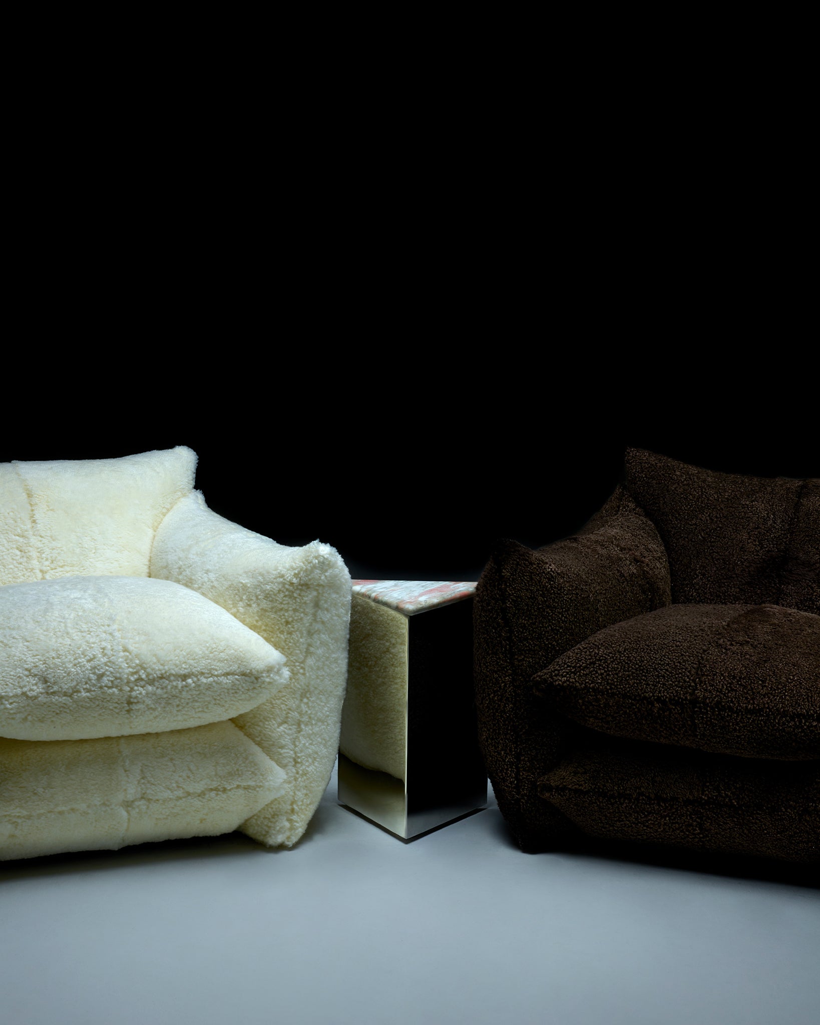 Small Prism Table with Norweigan Rose Marble top between Shearling Studio Chairs in Cloud and Bear