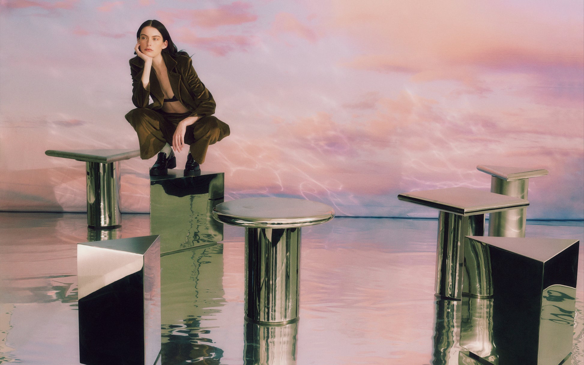 Model sits on a Large Prism Table with Stainless Steel top