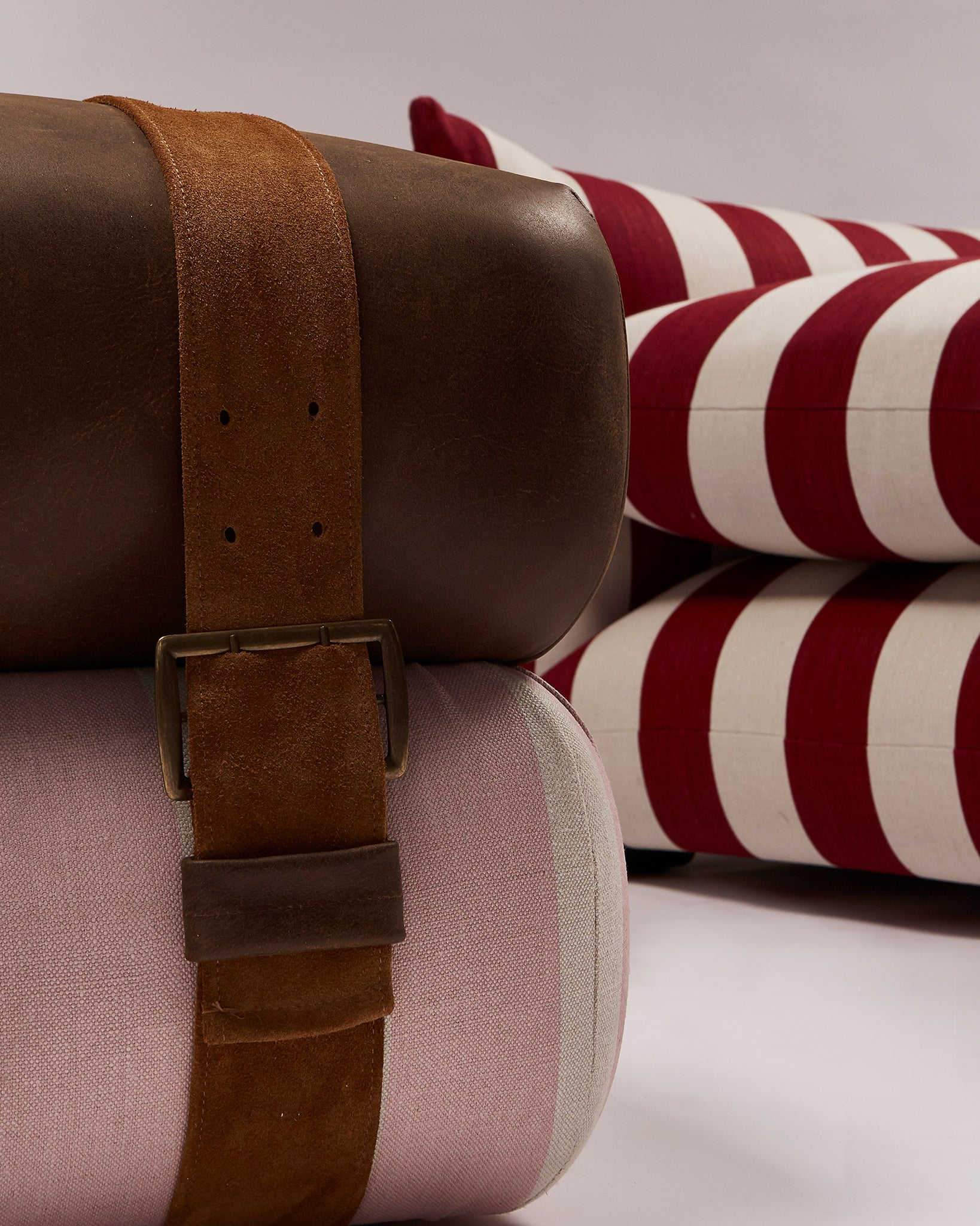 Studio Ottoman in Rose Studio Stripe, with straps